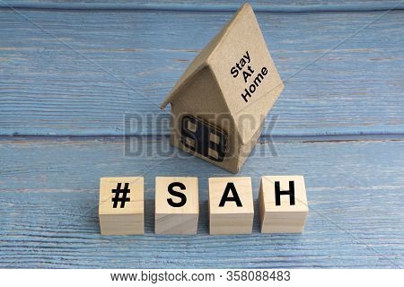 Concept Image A Wooden Block And Word - #sah ( Stay At Home ) On Wooden Background. Coronavirus And 