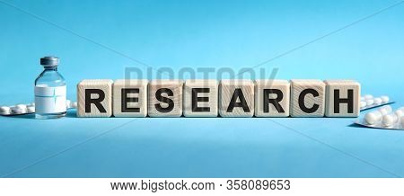 Research - Text On Cubes. Drug In Ambula, Tablets In Blisters To Reduce Disease Symptoms