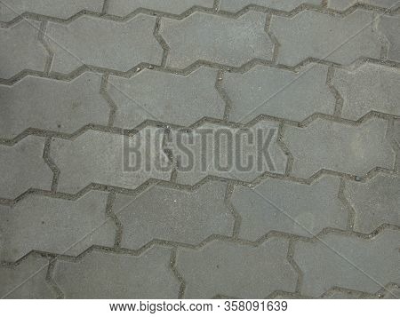 Gray Laid Curbstone Shaped Tiles Under Your Feet