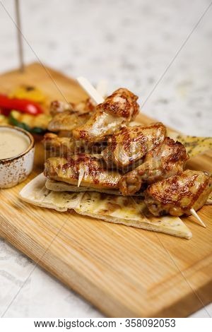 Grilled Chicken With Grilled Vegetables On Wooden Plate