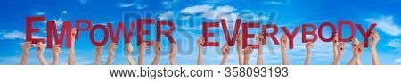 People Hands Holding Word Empower Everybody, Blue Sky