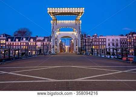 The Tiny Bridge at sunset in Amsterdam the Netherlands