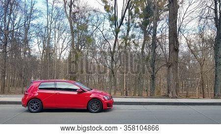 Ukraine, Kiev - March 27, 2020: Volkswagen Golf Gti Tcr Red In The Forest.