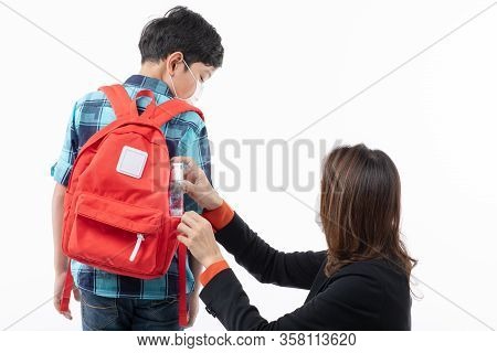 Asian Mother In Black Business Suit Giving And Putting Small Pocket Hand Washing Cleaning Gell Into 
