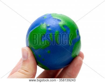 Rubber Ball In The Form Of A Globe Of The Planet Earth In The Hand