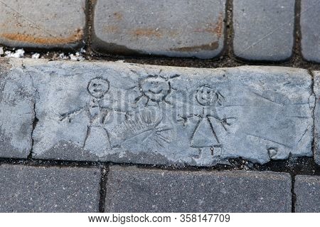 Drawing On Asphalt, Cement, Wall. The Guy And The Girl, The Sun Above Them, On Them Is A Trace From 