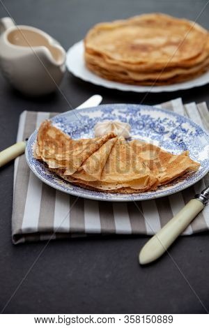 A Stack Of Thin Pancakes On A Plate. Homemade Pastries. Pancakes For Breakfast. Appetizing Food. Thi