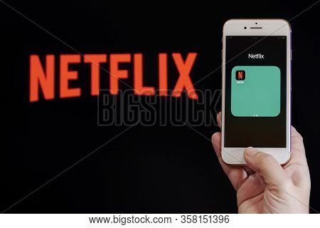 Thessaloniki, Greece - March 21 2020: Netflix Streaming Service Vod Content Provider Concept. Hand H