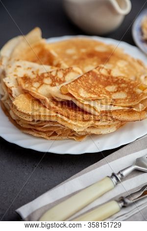 A Stack Of Thin Pancakes On A Plate. Homemade Pastries. Pancakes For Breakfast. Appetizing Food. Thi