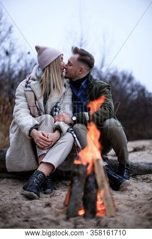 Winter Picnic On Baech With Bonfire. Love Story On Winter Foggy Sand Beach. Valentines Concept.