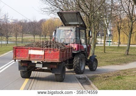 Tractor Driven Leaves From Cleaning City Streets, Spring Cleaning City Streets