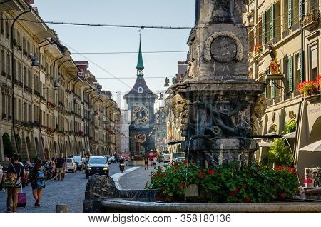 Bern, Switzerland - September 13, 2016: Street View Of Kramgasse With Fountain And Clock Tower In Th