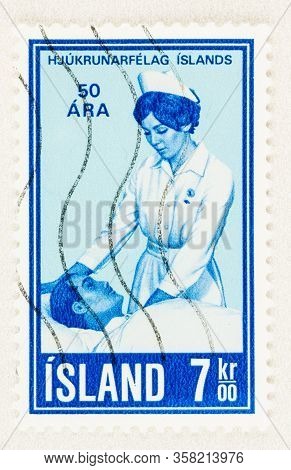 Seattle Washington - March 28, 2020: Close Up Of Iceland Stamp Featuring Nurse With Patient, Commemo