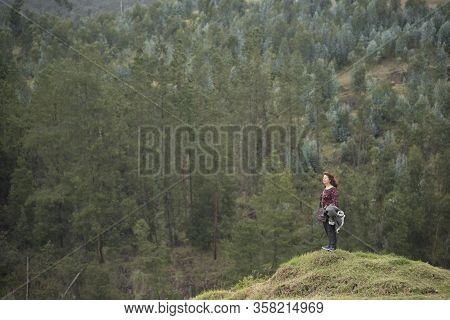 Nemocon, Cundinamarca / Colombia; March 24, 2018: Female Traveler On Top Of A Hill Admiring The Scen