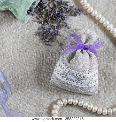 Small Linen Sack Filled With Dried Lavender Decorated With Lacework And Violet Ribbon, Two Sachets, 
