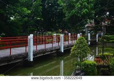 Manila, Ph - July 6: Bridge And Lake At Japanese Garden Inside Rizal Park On July 6, 2016 In Manila,