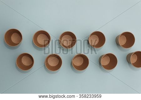 Many Craft Paper Cups For Coffee Or Any Drinks On A  Blue Paper Background. Concept Of Ziro Waste, N