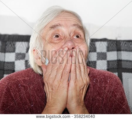 Elderly Woman In A Medical Mask