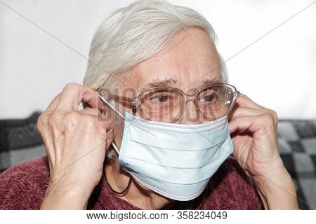 Elderly Woman In A Medical Mask