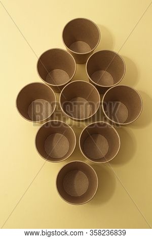 Many Craft Paper Cups For Coffee Or Any Drinks On A  Blue Paper Background. Concept Of Ziro Waste, N