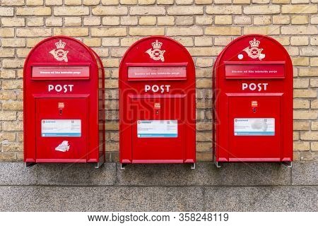Aarhus, Denmark - 24 March 2020: Red Vintage Mailbox, National Symbol, Tourist Attraction. Danish Le
