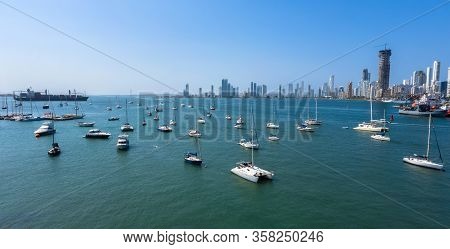 Cargo Ship Left Port In Cartagena, Colombia. Beautiful Yachts Drift In The Bay. Panorama The Bocagra