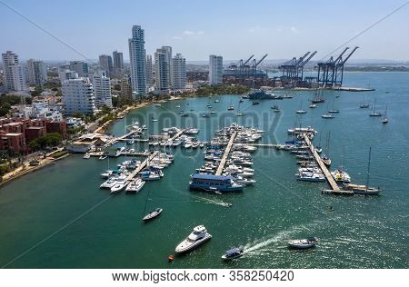 Aerial View Of A Cargo Port In Cartagena, Colombia. Beautiful View Of The Bay With Yachts And Modern