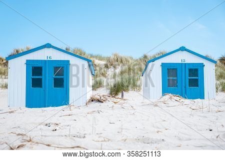 Texel Island Netherlands, Blue White Beach Hut On The Beach With On The Background The Sand Dunes Of