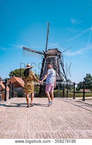Young Couple On Vacation Friesland Netherlands Sloten, Old Town Of Sloten Netherlands With Canals An