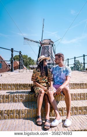 Young Couple On Vacation Friesland Netherlands Sloten, Old Town Of Sloten Netherlands With Canals An