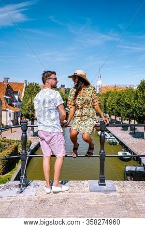 Young Couple On Vacation Friesland Netherlands Sloten, Old Town Of Sloten Netherlands With Canals An