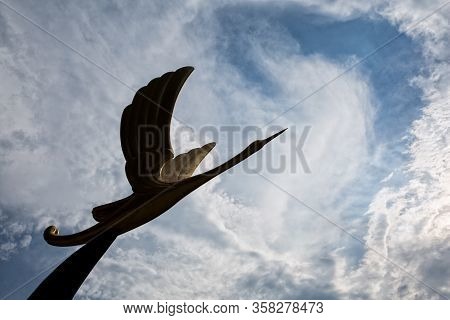 A Stone Bird Flying Over The Sky