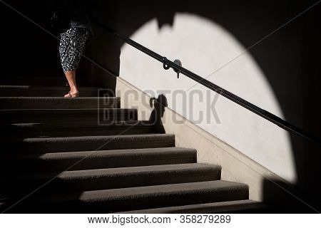 Two Women Walking At A Staircase, Un Go Up, The Other Go Down