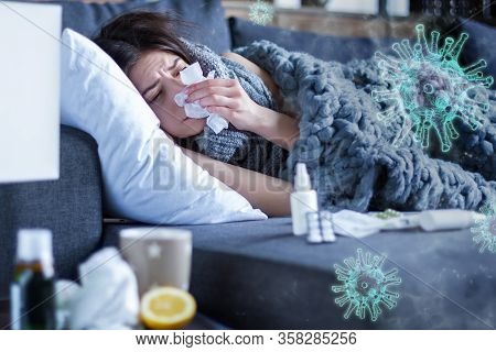 Young Woman Is Feeling Bad And Sick Lying In Bed At Home. Girl Has Symptoms Of Acute Respiratory Vir