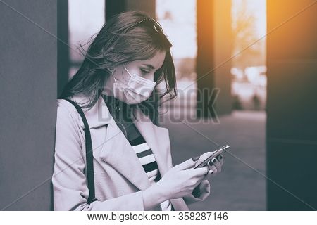 Young Woman Wearing Protection Face Mask Against Coronavirus Covid-19 Aka 2019-ncov Is Looking For I