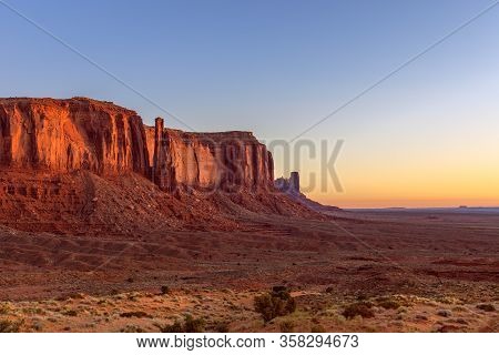 View Of Monument Valley In The Taime Of Beautiful Sunrise On The Border Between Arizona And Utah, Us