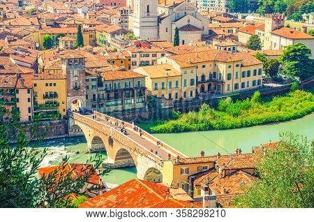The Ponte Pietra Stone Bridge, Pons Marmoreus, Roman Arch Bridge Across Adige River, Buildings With 