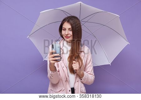 Image Of Beautiful Tender Attractive Young Woman Making Selfie, Talking Over Videocall, Holding Smar