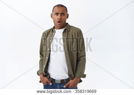 Portrait Of Shocked, Frustrated And Astonished African American Man, Cringe At Something Bothering A