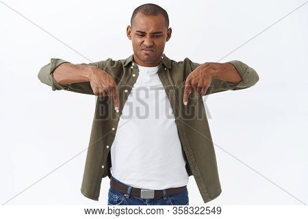Portrait Of Disappointed, Judgemental African-american Man, Grimacing Angry, Pointing And Looking Do