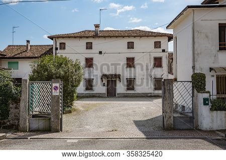 Manzano, Italy - 25.03.2020: View Of Old Typical Italian House. Little Italian City During An Epidem