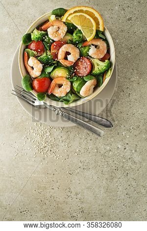 Healthy Green Salad With Grilled Shrimps And Vegetables On Grey Background. Grilled Prawns. Healthy 