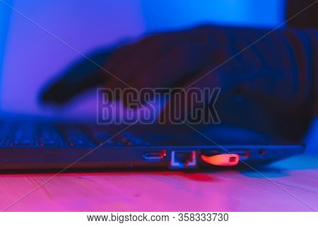 Online Theft Of Personal Data, Computer Hacking. Hacker Man Using A Laptop Attacks The Web. Personal