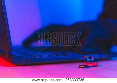 Online Theft Of Personal Data, Computer Hacking. Hacker Man Using A Laptop Attacks The Web. Personal