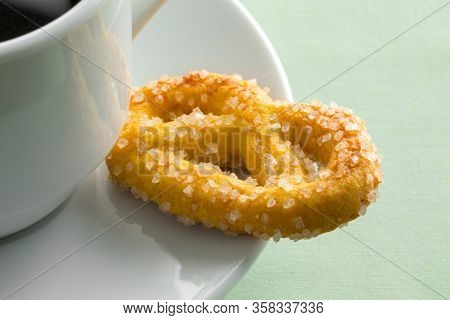 Traditional dutch sweet cookie called krakeling with a cup of coffee