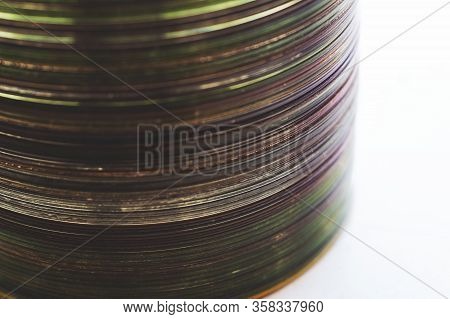 Lot Of Old Cds Stacked On The Windowsill