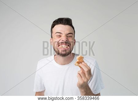 Young Man Isolated Over Background. Cheerful Happy But Strange Guy Smiling Wide And Showing Teeth Wi