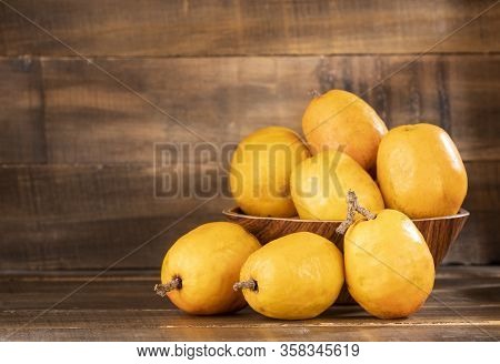 Spondias Purpurea - Delicious Tropical Fruit. Wood Background