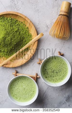 Matcha Green Powder And Tea On Gray Concrete Background