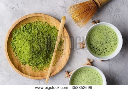 Matcha Green Powder And Tea On Gray Concrete Background